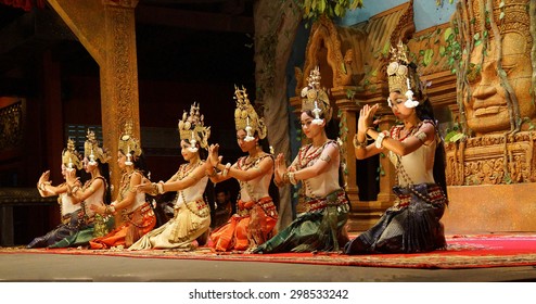 SIEM REAP, CAMBODIA - FEB 14, 2015 - Apsara dancers kneel at the end of a performance, Siem Reap,  Cambodia