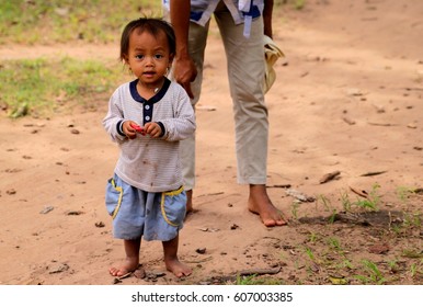 SIEM REAP, CAMBODIA - June 23, 2011: Cambodian kid with mother at Siem Reap, Cambodia