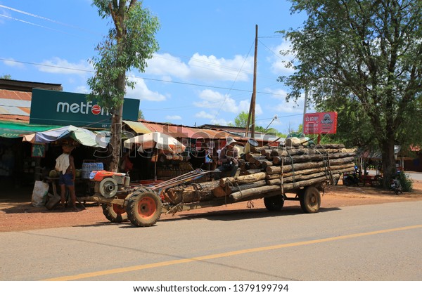 siem reap/ cambodia- march 5 2018: the worker\
drive the Container Car and deliver wood to destination. cambodia\
forest is dangerous ad the human settlement development and demand\
of wood raw material