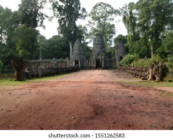 SIEM REAP - CAMBODIA - OCTOBER 13, 2019: Preah Khan, A Large Temple Complex At Angkor Archaeological Park, Has Four Gates With Stunning Khmer Architecture Ruins And Stupa With Direct Sunlight.