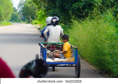 SIEM REAP, CAMBODIA - OCTOBER 19, 2016: Family On The Bycicle