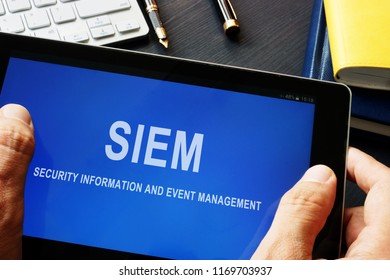 SIEM Security Information And Event Management Program In A Tablet.