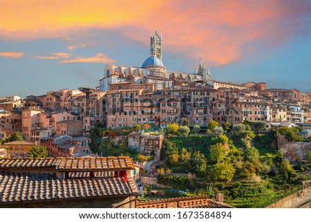 Siena - amazing medieval town at sunset with view of the Dome & Bell Tower of Siena Cathedral (Duomo di Siena), landmark Mangia Tower and Basilica of San Domenico,Italy