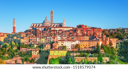 Siena - beautiful medieval town at sunset with view of the Dome & Bell Tower of Siena Cathedral (Duomo di Siena), landmark Mangia Tower and Basilica of San Domenico,Italy