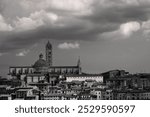 Siena Cityscape with Cathedral or Duomo di Siena Church and Dramatic Sky