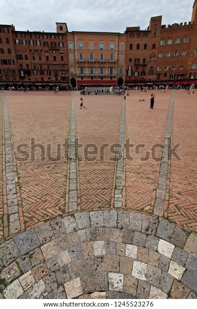 SIENA, ITALY -\
05/29/2018: Siena\'s Piazza del Campo, the principal public space of\
the historic center of Siena, Tuscany, Italy. Regarded as one of\
Europe\'s greatest medieval\
squares.