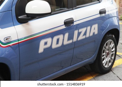 Siena, Italy / September, 2019 / Italian Police Car Parked Up Outside A Police Station, Clearly Showing The Polizia Decal Down The Side Of The Vehicle.