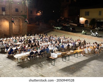 Siena, Tuscany, Italy - August 14 2021: Contrade Dinner At The Nobile Contrada Dell'Oca Or Goose Contrada.