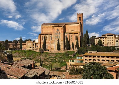 Siena, Tuscany, Italy: cityscape with the medieval church Basilica of San Domenico on the hill in the old town of the city 

