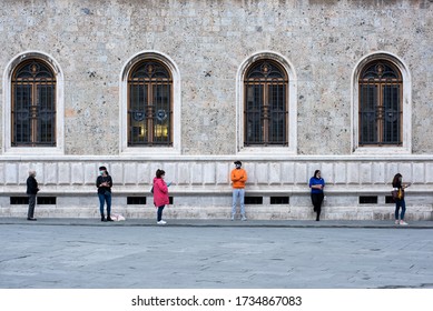 Siena, Tuscany, Italy - May 18th,2020 : People Wearng Masks Standing In Line Outside Store/office, COVID-19 Safe Social Distancing Practice