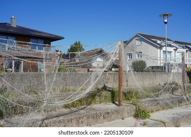 Sierksdorf, Germany - September 22, 2022: Stretched Fishing Nets In Front Of House At The German Baltic Coast In The Bay Of Lübeck