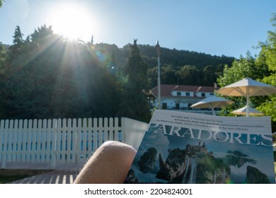 Sierra De Cazorla, Cazorla Mountain Range Nature Reserve, Jaen Province, Andalucia, Spain, Europe On June 22, 2022. The State Run Hotel Parador De Cazorla, Woman Sunbathing In A Hammock By The Parador