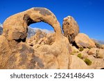 SIerra Nevada, seen through stone arches of the Alabama HIlls