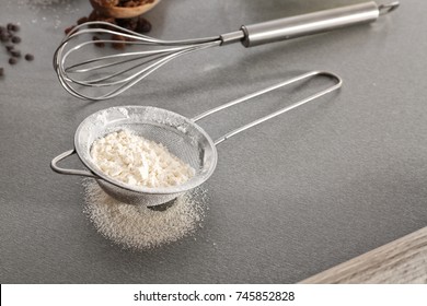 Sieve With Flour On Gray Table