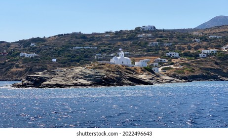 Sifnos, Greece - June 23 2021: The chapel of Chrisopigi Monastery at the entrance to Pharos bay on Sifnos island