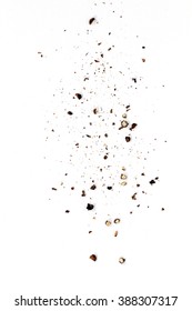 Sifting Heavy Ground Black Pepper Over White Background.