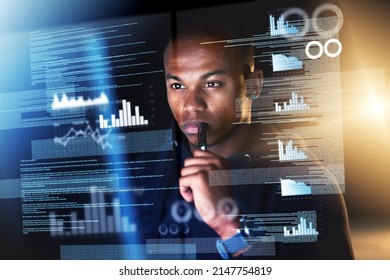 Sifting through streams of data. Cropped shot of a young male programmer sifting through data streams while coding.
