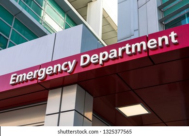 A sign above the entrance to an Emergency Department at a hospital.