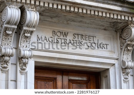 Sign above the entrance to the historic Bow Street Magistrates Court building in London, UK.  The building is now a hotel.