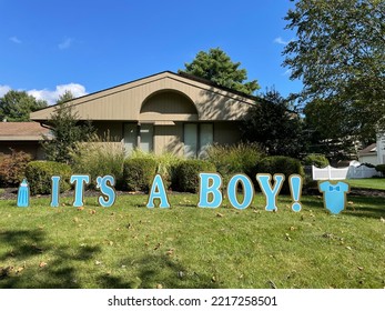 A Sign Across A Front Lawn That Says 