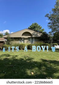 A Sign Across A Front Lawn That Says 