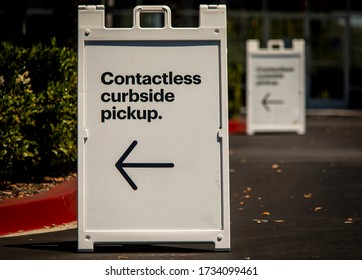 Sign Advertising Contactless Curbside Pickup At Retail Store Parking Lot