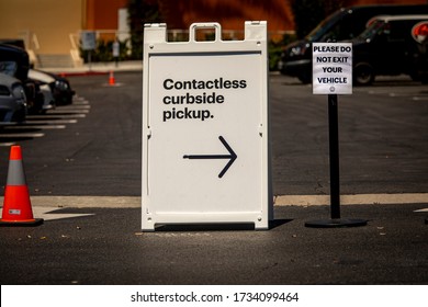 Sign Advertising Contactless Curbside Pickup At Retail Store Parking Lot