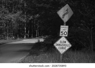 Sign Alerting Driver To Slow Down Because Of A Dangerous Curve Ahead.