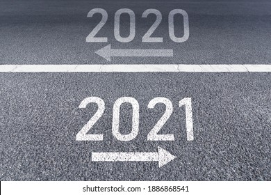 The Sign Arrow Back To The 2020 Year And Go Ahead 2021 Written On The Asphalt Road Background The Vision New Year Of 2021.