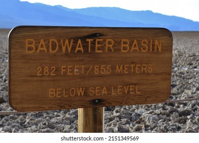 Sign for Badwater Basin the lowest point in the western hemisphere at 282 feet or 855 meters below sea level at Death Valley National Park in California