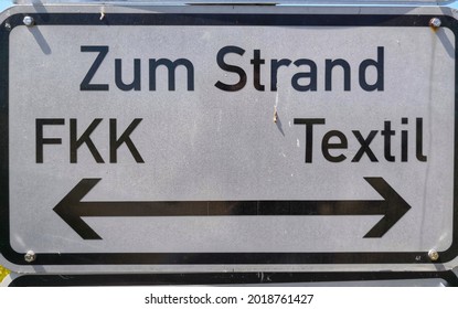 Sign at the beach indicating the nudist beach in German language