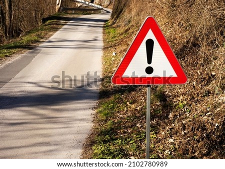 Sign for being cautious on the road up front