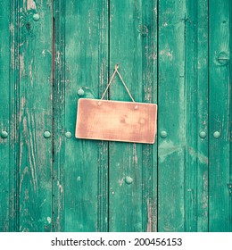 Sign Board Blank On Vintage Mint Green Wooden Planks Wall Background