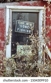 A Sign Board On A Door Saying Sorry We Are Gone Fishing In Nome, Alaska.