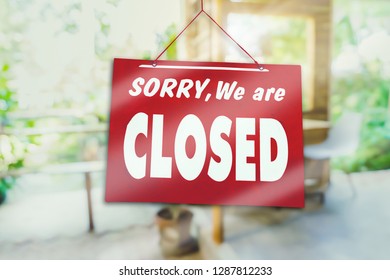 A Sign board of sorry we are closed hang on door of business shop with nature green background - Shutterstock ID 1287812233
