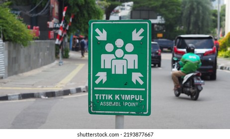 A sign board that says assembly point or 'Titik Kumpul' - Shutterstock ID 2193877667