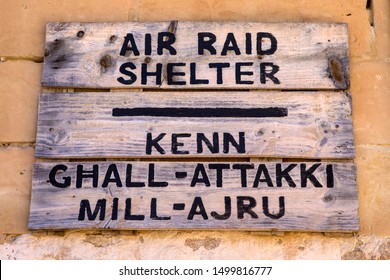 Sign in both english and Maltese, to the historic Air Raid Shelter in the town of Mellieha in Malta.  