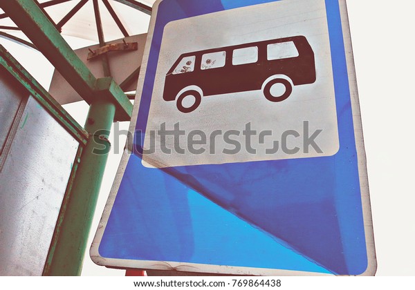 \
Sign of bus stop with\
painted people