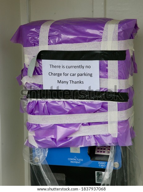 A sign in the car park indicating that whilst the\
coronavirus disease is still prevalent, there is no charge to park\
your vehicle