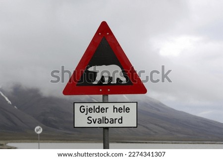 Sign caution polar bear in the city of Longyearbyen, Spitsbergen, Svalbard