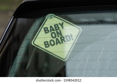 Sign The Child On Board. Warning About The Child In The Car. The Sign Of The Child In The Car On The Rear Window Of The Car. Glass Misted Inside With Raindrops. Road Safety. Selective Focus.