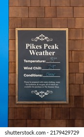 Sign At The Cog Railway Station For Weather At The Top Of Pike's Peak With Temperature, Wind Chill And Conditions With Suggestions For How To Prepare