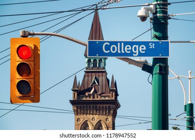 Sign For College Street At Spadina In Downtown Toronto, Canada. 