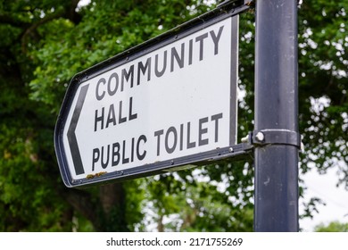 Sign To The Community Hall And Public Toilet In A Rural Village.