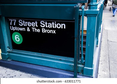 Sign depicting its the entrance to the 77 st. subway station for passengers going uptown & the Bronx, New-York.