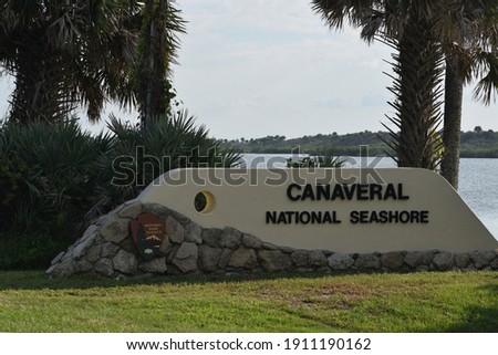 A sign designates the entrance to Canaveral National Seashore, USA.