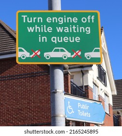 Sign Directing Car Drivers To Stop Engines Whilst Queueing To Enter Car Park Opposite Residential Housing Within A UK Clean Air Zone. Emissions Reduction Initiative.