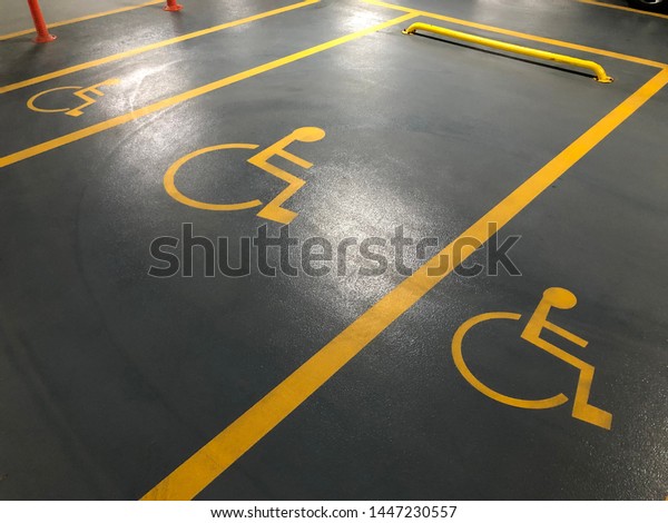Sign of disabled parking. In the parking lot of the\
mall. 