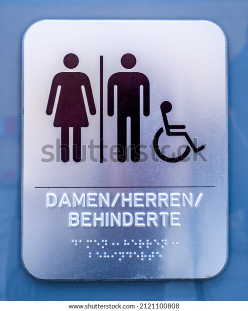 sign for disabled people in germany: translation:\
Woman, Man, Disabled\
people