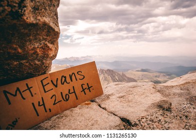 Sign displaying the elevation over Mt. Evans in Colorado.